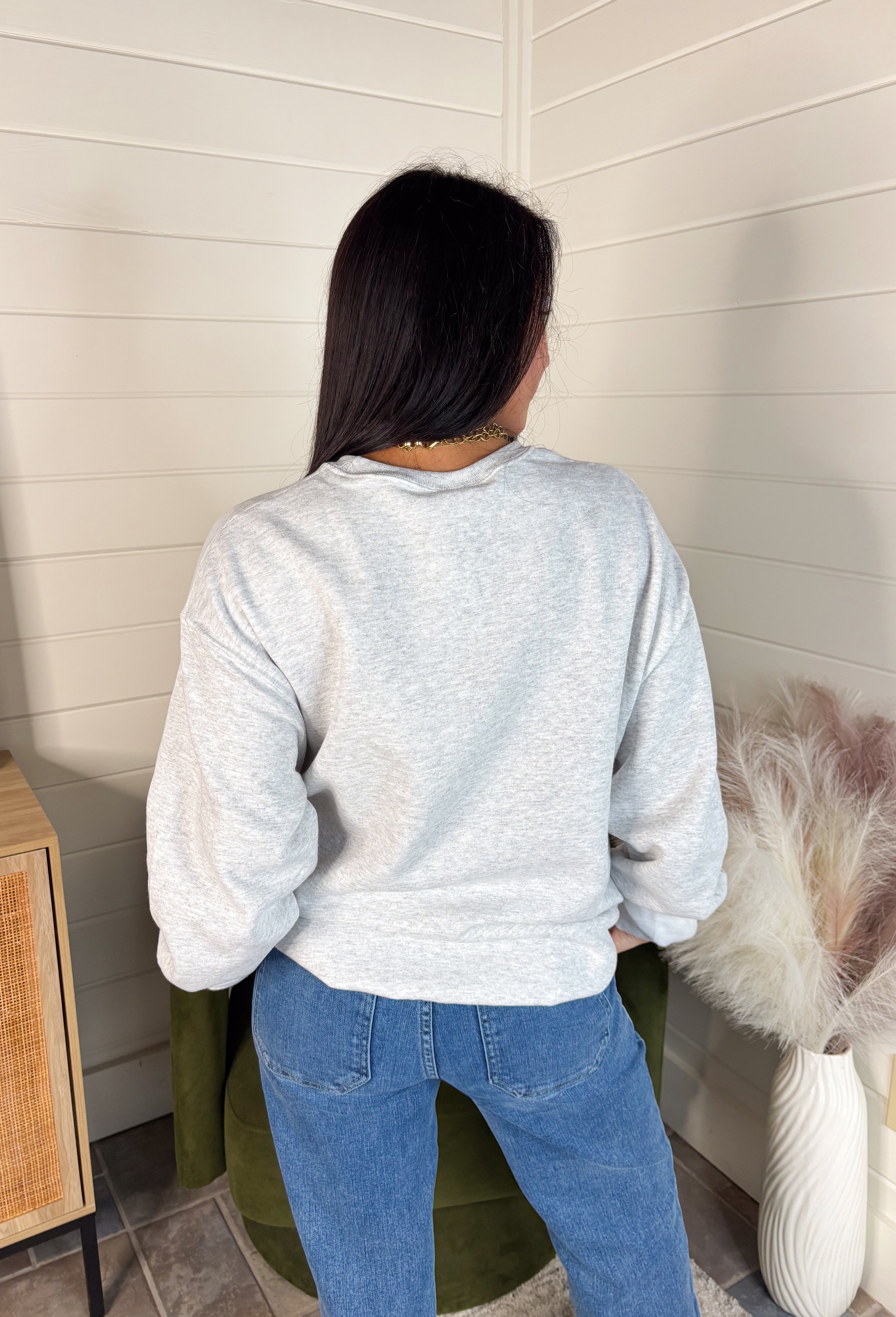 Spread a little holiday cheer with this cozy fleece-lined pullover! Designed in soft light gray with festive red lettering that reads “Have Yourself A Merry Little Christmas,” this sweatshirt is as merry as it is comfortable. Perfect for holiday movie nights, gift wrapping marathons, or sipping cocoa by the tree — it’s the ultimate feel-good piece for the season.