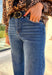 Add a touch of glam to your winter denim collection with these high-waisted wide leg jeans by Risen. Designed in a medium wash with striking black rhinestone detailing along the front, this pair blends everyday comfort with just the right amount of sparkle. The soft stretch denim and flattering wide leg silhouette make them perfect for dressing up or down all season long.