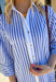 Bright, cheerful, and perfect for spring days, this blue and white striped long sleeve dress brings an easy, sunshine-filled feel to your wardrobe. The classic stripe pattern feels fresh and timeless, while the button-down design with a crisp white band and collared neckline adds a polished touch. Fully lined for comfortable wear, this dress is an effortless option for brunch, daytime events, or spring outings.