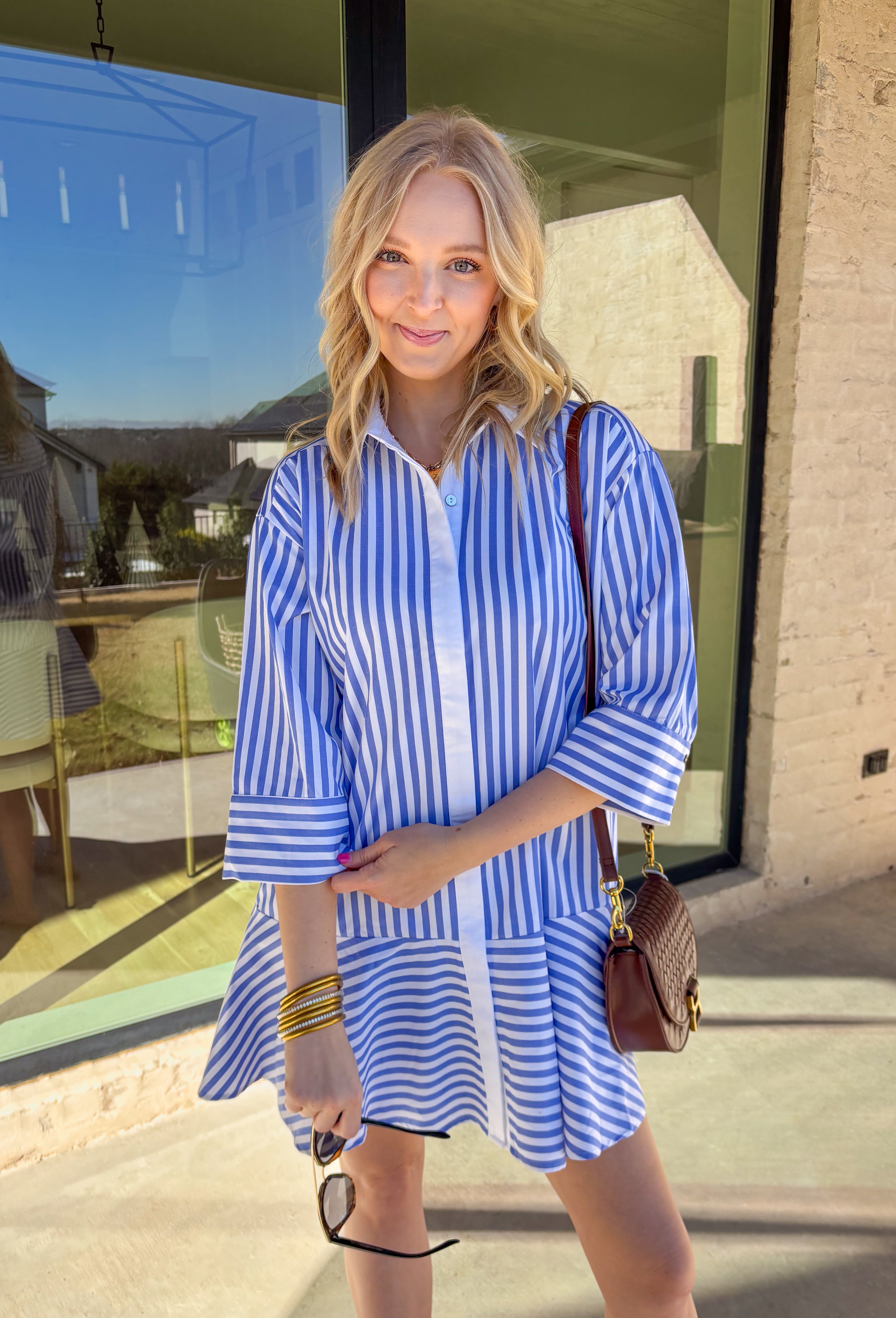 Bright, cheerful, and perfect for spring days, this blue and white striped long sleeve dress brings an easy, sunshine-filled feel to your wardrobe. The classic stripe pattern feels fresh and timeless, while the button-down design with a crisp white band and collared neckline adds a polished touch. Fully lined for comfortable wear, this dress is an effortless option for brunch, daytime events, or spring outings.