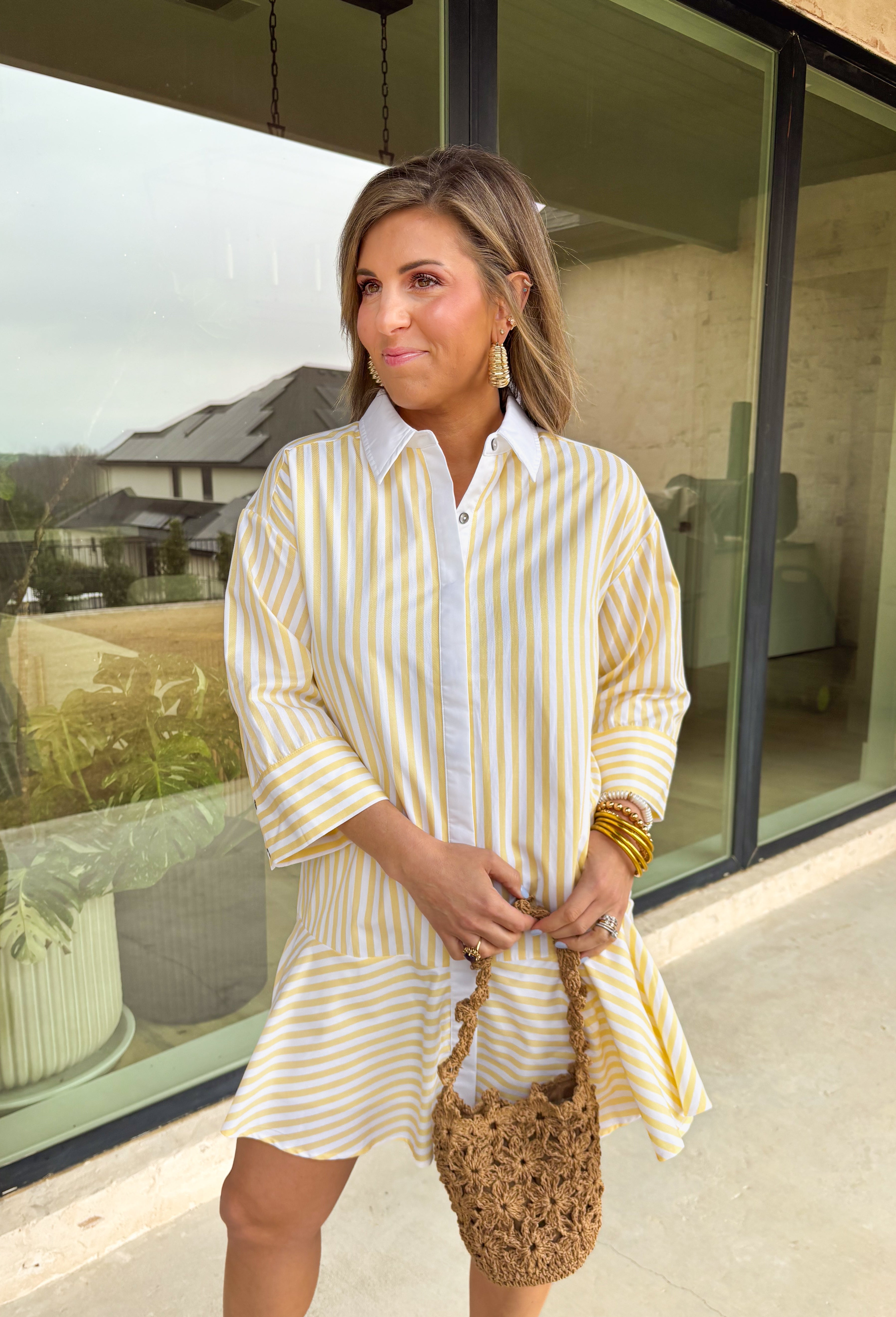 Bright, cheerful, and perfect for spring days, this yellow and white striped long sleeve dress brings an easy, sunshine-filled feel to your wardrobe. The classic stripe pattern feels fresh and timeless, while the button-down design with a crisp white band and collared neckline adds a polished touch. Fully lined for comfortable wear, this dress is an effortless option for brunch, daytime events, or spring outings.