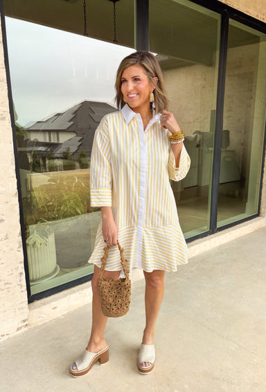 Bright, cheerful, and perfect for spring days, this yellow and white striped long sleeve dress brings an easy, sunshine-filled feel to your wardrobe. The classic stripe pattern feels fresh and timeless, while the button-down design with a crisp white band and collared neckline adds a polished touch. Fully lined for comfortable wear, this dress is an effortless option for brunch, daytime events, or spring outings.