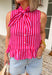 This pink and red striped peplum top is bringing all the fun, feminine summer vibes. The bold stripe combo makes such a statement, while the peplum silhouette creates a flattering, easy-to-wear shape. The tie neck detail and button front add that extra touch of charm, and the ruffle hem keeps it light and playful. Made from breathable cotton, it’s perfect for warm days when you still want to feel put together. Pair it with white denim or shorts.