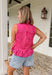 This pink and red striped peplum top is bringing all the fun, feminine summer vibes. The bold stripe combo makes such a statement, while the peplum silhouette creates a flattering, easy-to-wear shape. The tie neck detail and button front add that extra touch of charm, and the ruffle hem keeps it light and playful. Made from breathable cotton, it’s perfect for warm days when you still want to feel put together. Pair it with white denim or shorts.
