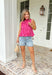 This pink and red striped peplum top is bringing all the fun, feminine summer vibes. The bold stripe combo makes such a statement, while the peplum silhouette creates a flattering, easy-to-wear shape. The tie neck detail and button front add that extra touch of charm, and the ruffle hem keeps it light and playful. Made from breathable cotton, it’s perfect for warm days when you still want to feel put together. Pair it with white denim or shorts.