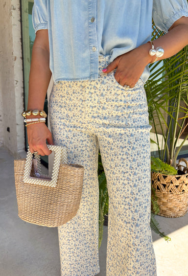 These neutral wide leg jeans with a dainty blue floral print are such a fresh take on summer denim! The soft floral pattern adds a subtle, feminine touch while still keeping them easy to style for everyday wear. Designed with a flattering wide leg fit and just the right amount of stretch, they’re comfortable, breathable, and perfect for warm days when you still want to look put together. Pair them with a simple tank or lightweight blouse and let the print shine.