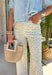 These neutral wide leg jeans with a dainty blue floral print are such a fresh take on summer denim! The soft floral pattern adds a subtle, feminine touch while still keeping them easy to style for everyday wear. Designed with a flattering wide leg fit and just the right amount of stretch, they’re comfortable, breathable, and perfect for warm days when you still want to look put together. Pair them with a simple tank or lightweight blouse and let the print shine.