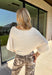 A timeless sweater is a staple every wardrobe needs, and this classic knit from Hyfve is one you'll wear season after season. Designed in a versatile cream hue, this cozy short sleeve sweater offers endless styling possibilities. The simple silhouette makes it easy to pair with everything from your favorite denim to tailored trousers, while the soft knit keeps you comfortable throughout the day. 