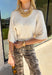 A timeless sweater is a staple every wardrobe needs, and this classic knit from Hyfve is one you'll wear season after season. Designed in a versatile cream hue, this cozy short sleeve sweater offers endless styling possibilities. The simple silhouette makes it easy to pair with everything from your favorite denim to tailored trousers, while the soft knit keeps you comfortable throughout the day. 