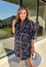 Denim gets a colorful fall refresh with this printed dress from Entro. The denim fabric is covered in a beautiful floral print featuring shades of autumn, giving a classic favorite a fun seasonal twist. A collared neckline and button-front closure bring in that timeless shirt dress feel, while long sleeves make it an easy choice as cooler weather rolls in. Convenient side pockets add an everyday touch, and the cotton-blend fabric has just a hint of stretch for comfortable wear. 