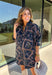 Denim gets a colorful fall refresh with this printed dress from Entro. The denim fabric is covered in a beautiful floral print featuring shades of autumn, giving a classic favorite a fun seasonal twist. A collared neckline and button-front closure bring in that timeless shirt dress feel, while long sleeves make it an easy choice as cooler weather rolls in. Convenient side pockets add an everyday touch, and the cotton-blend fabric has just a hint of stretch for comfortable wear. 