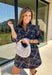 Denim gets a colorful fall refresh with this printed dress from Entro. The denim fabric is covered in a beautiful floral print featuring shades of autumn, giving a classic favorite a fun seasonal twist. A collared neckline and button-front closure bring in that timeless shirt dress feel, while long sleeves make it an easy choice as cooler weather rolls in. Convenient side pockets add an everyday touch, and the cotton-blend fabric has just a hint of stretch for comfortable wear. 