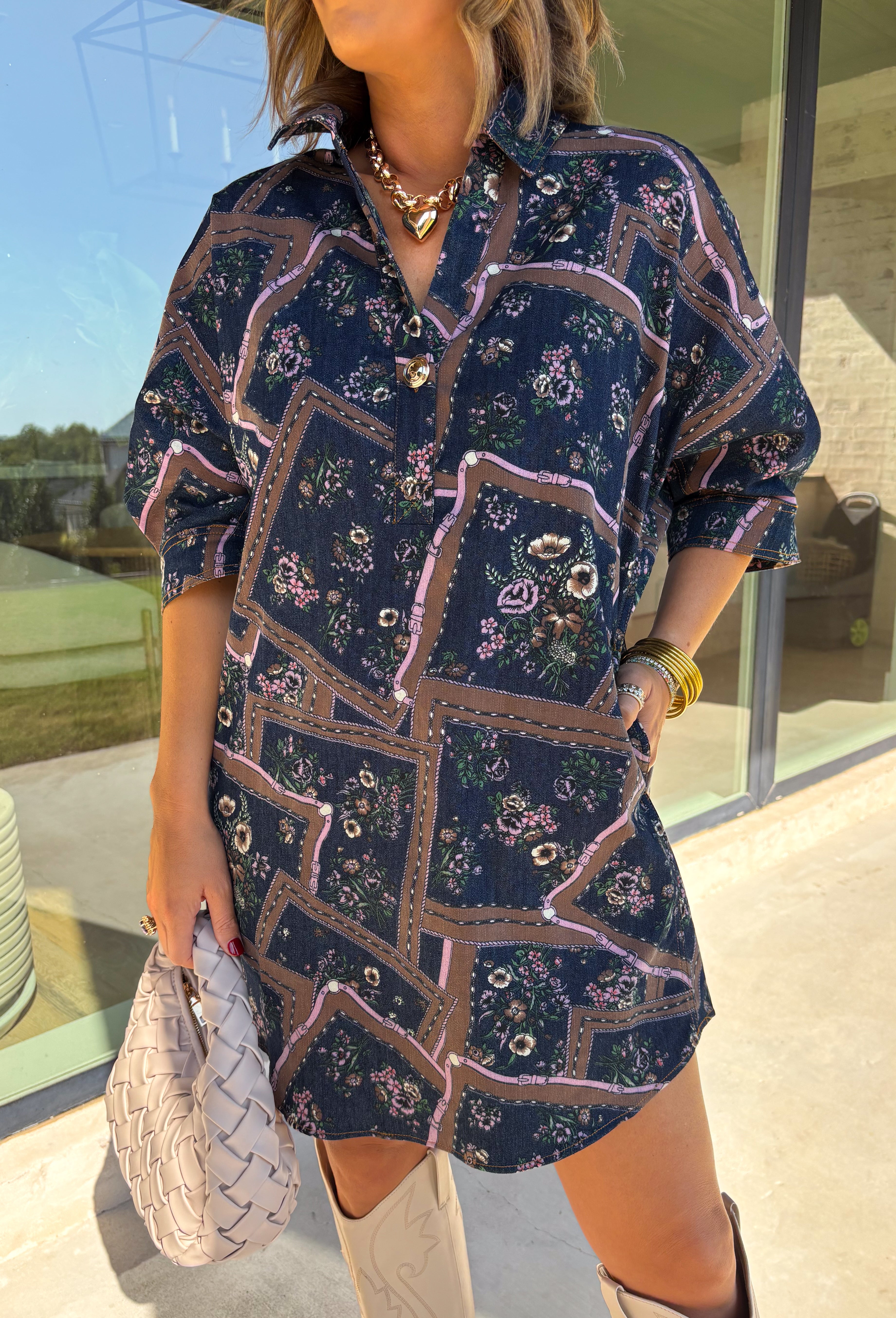 Denim gets a colorful fall refresh with this printed dress from Entro. The denim fabric is covered in a beautiful floral print featuring shades of autumn, giving a classic favorite a fun seasonal twist. A collared neckline and button-front closure bring in that timeless shirt dress feel, while long sleeves make it an easy choice as cooler weather rolls in. Convenient side pockets add an everyday touch, and the cotton-blend fabric has just a hint of stretch for comfortable wear. 