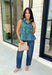 Bring a fresh pop of color to your fall wardrobe with this effortlessly charming paisley top. Featuring a beautiful green backdrop with a light blue paisley print, this sleeveless blouse is equal parts classic and feminine. The ruffled neckline and button-front details add a polished touch, while the peplum hem creates a flattering silhouette that's easy to wear from workdays to weekends. 