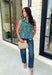 Bring a fresh pop of color to your fall wardrobe with this effortlessly charming paisley top. Featuring a beautiful green backdrop with a light blue paisley print, this sleeveless blouse is equal parts classic and feminine. The ruffled neckline and button-front details add a polished touch, while the peplum hem creates a flattering silhouette that's easy to wear from workdays to weekends. 