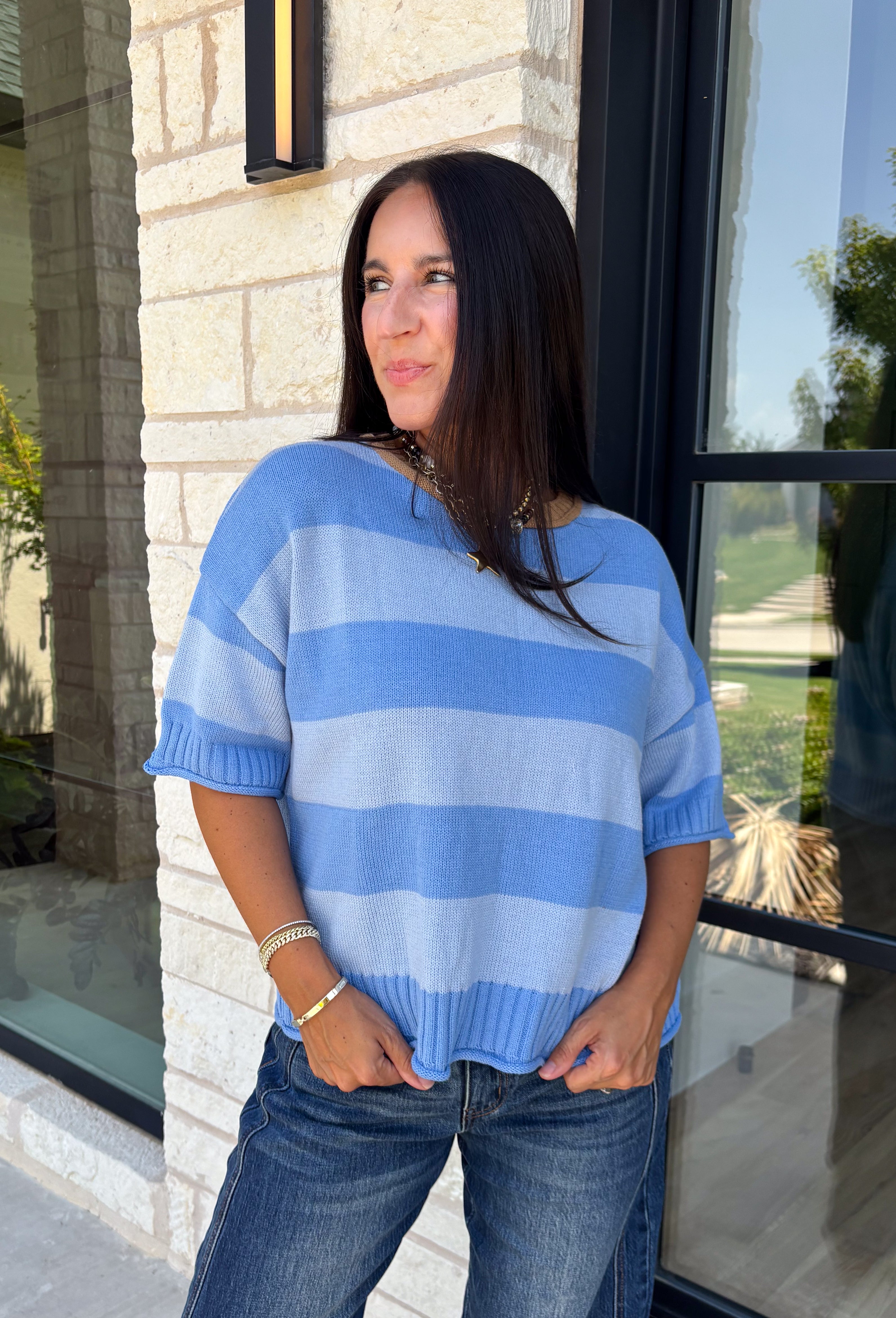 Soft, cozy, and effortlessly classic, this striped sweater is the perfect piece for transitioning into fall! Featuring light blue stripes with warm tan trim along the neckline, this knit blends timeless style with a fresh seasonal color palette. Ribbed detailing at the sleeves and hem adds a polished finish, while the breathable cotton blend keeps it comfortable for layering or wearing on its own. 