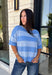 Soft, cozy, and effortlessly classic, this striped sweater is the perfect piece for transitioning into fall! Featuring light blue stripes with warm tan trim along the neckline, this knit blends timeless style with a fresh seasonal color palette. Ribbed detailing at the sleeves and hem adds a polished finish, while the breathable cotton blend keeps it comfortable for layering or wearing on its own. 