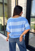 Soft, cozy, and effortlessly classic, this striped sweater is the perfect piece for transitioning into fall! Featuring light blue stripes with warm tan trim along the neckline, this knit blends timeless style with a fresh seasonal color palette. Ribbed detailing at the sleeves and hem adds a polished finish, while the breathable cotton blend keeps it comfortable for layering or wearing on its own. 