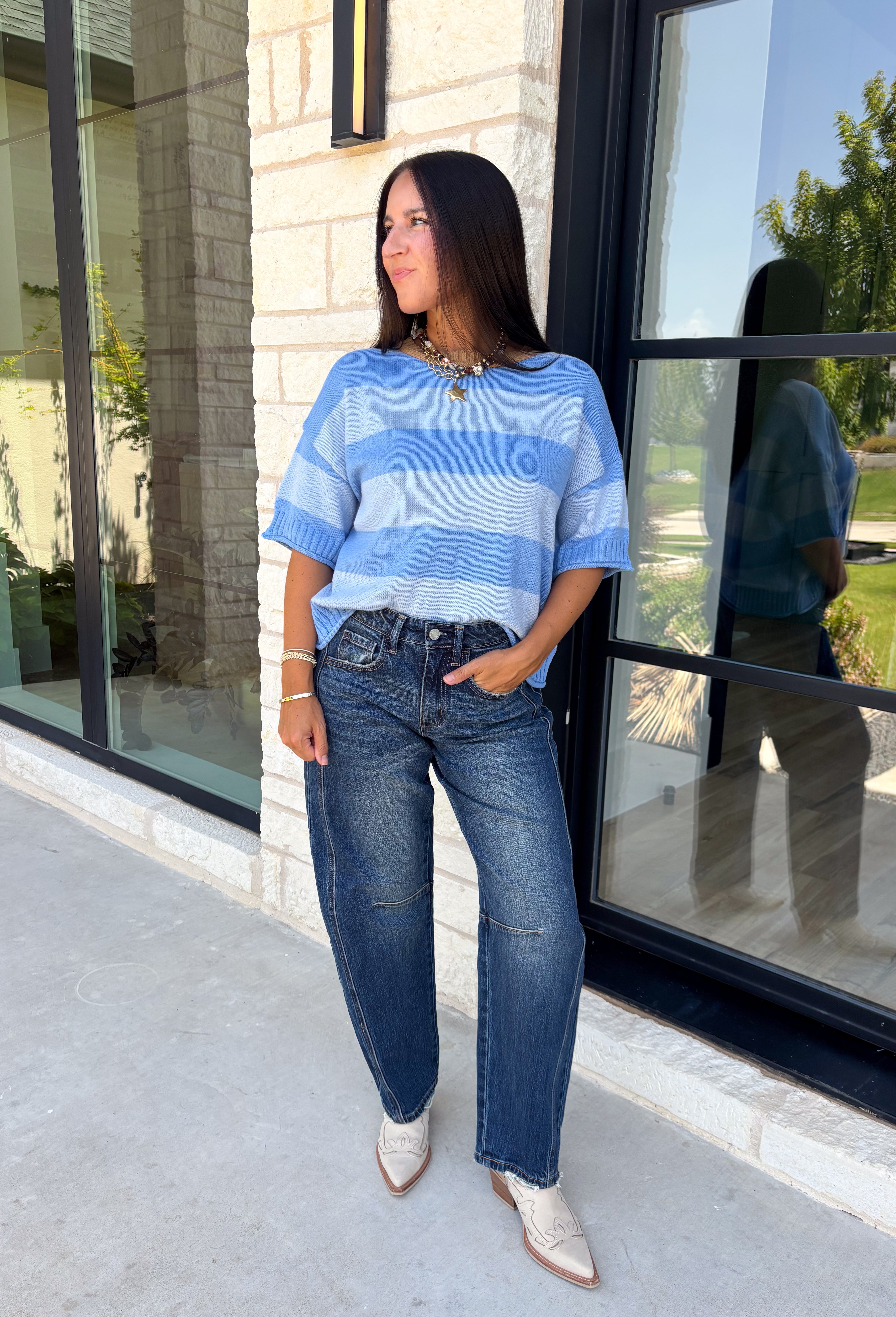 Soft, cozy, and effortlessly classic, this striped sweater is the perfect piece for transitioning into fall! Featuring light blue stripes with warm tan trim along the neckline, this knit blends timeless style with a fresh seasonal color palette. Ribbed detailing at the sleeves and hem adds a polished finish, while the breathable cotton blend keeps it comfortable for layering or wearing on its own. 