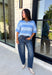 Soft, cozy, and effortlessly classic, this striped sweater is the perfect piece for transitioning into fall! Featuring light blue stripes with warm tan trim along the neckline, this knit blends timeless style with a fresh seasonal color palette. Ribbed detailing at the sleeves and hem adds a polished finish, while the breathable cotton blend keeps it comfortable for layering or wearing on its own. 