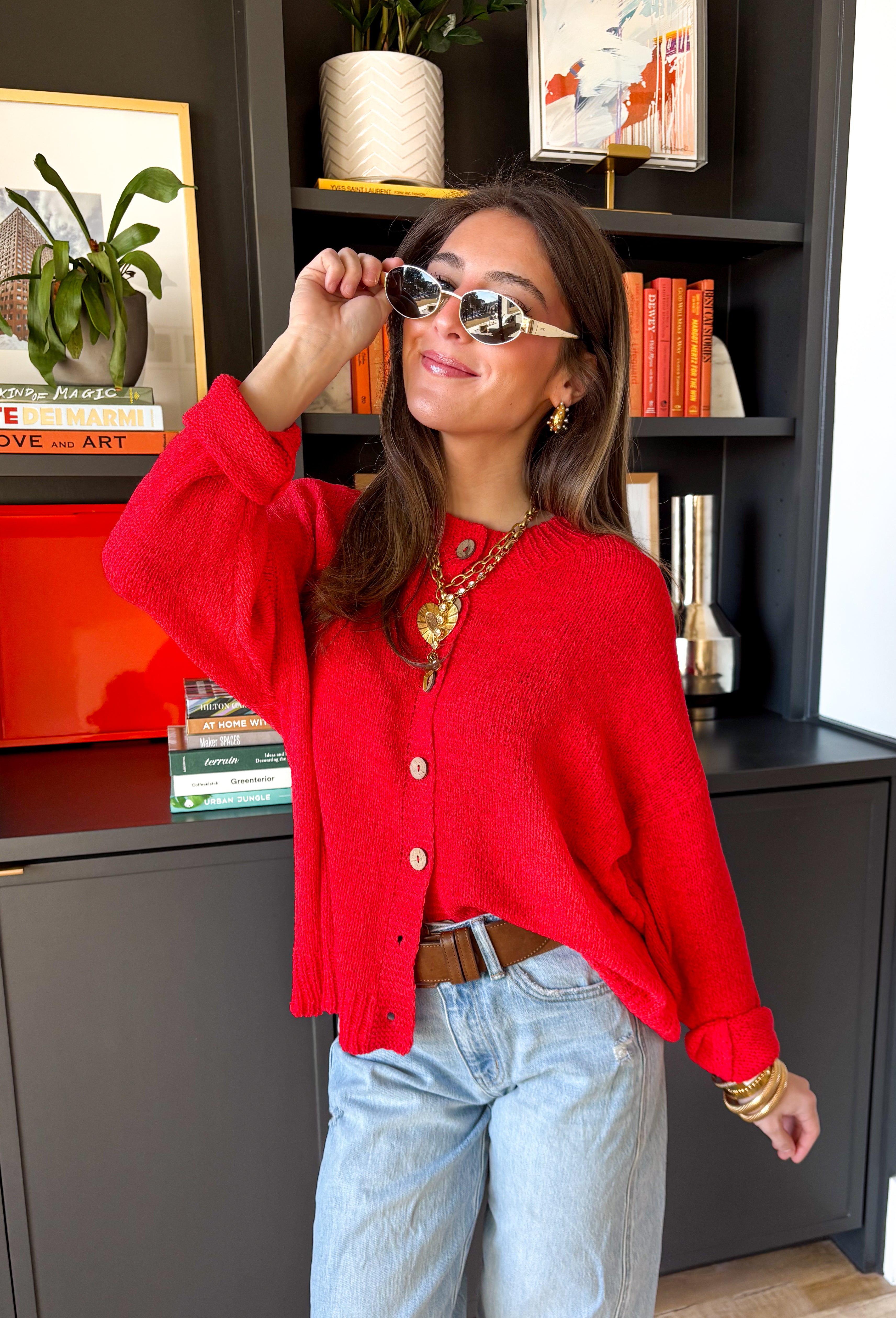 Bright, lightweight, and perfect for spring layering, this red knit button-down cardigan by Wishlist is an easy way to add a pop of color to any outfit. The soft, lightweight knit makes it ideal for tossing on during cool mornings or breezy evenings, while the classic button-down design keeps it timeless and versatile. Wear it buttoned up as a top or layered over a tank for effortless spring styling.