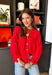 Bright, lightweight, and perfect for spring layering, this red knit button-down cardigan by Wishlist is an easy way to add a pop of color to any outfit. The soft, lightweight knit makes it ideal for tossing on during cool mornings or breezy evenings, while the classic button-down design keeps it timeless and versatile. Wear it buttoned up as a top or layered over a tank for effortless spring styling.