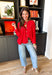 Bright, lightweight, and perfect for spring layering, this red knit button-down cardigan by Wishlist is an easy way to add a pop of color to any outfit. The soft, lightweight knit makes it ideal for tossing on during cool mornings or breezy evenings, while the classic button-down design keeps it timeless and versatile. Wear it buttoned up as a top or layered over a tank for effortless spring styling.