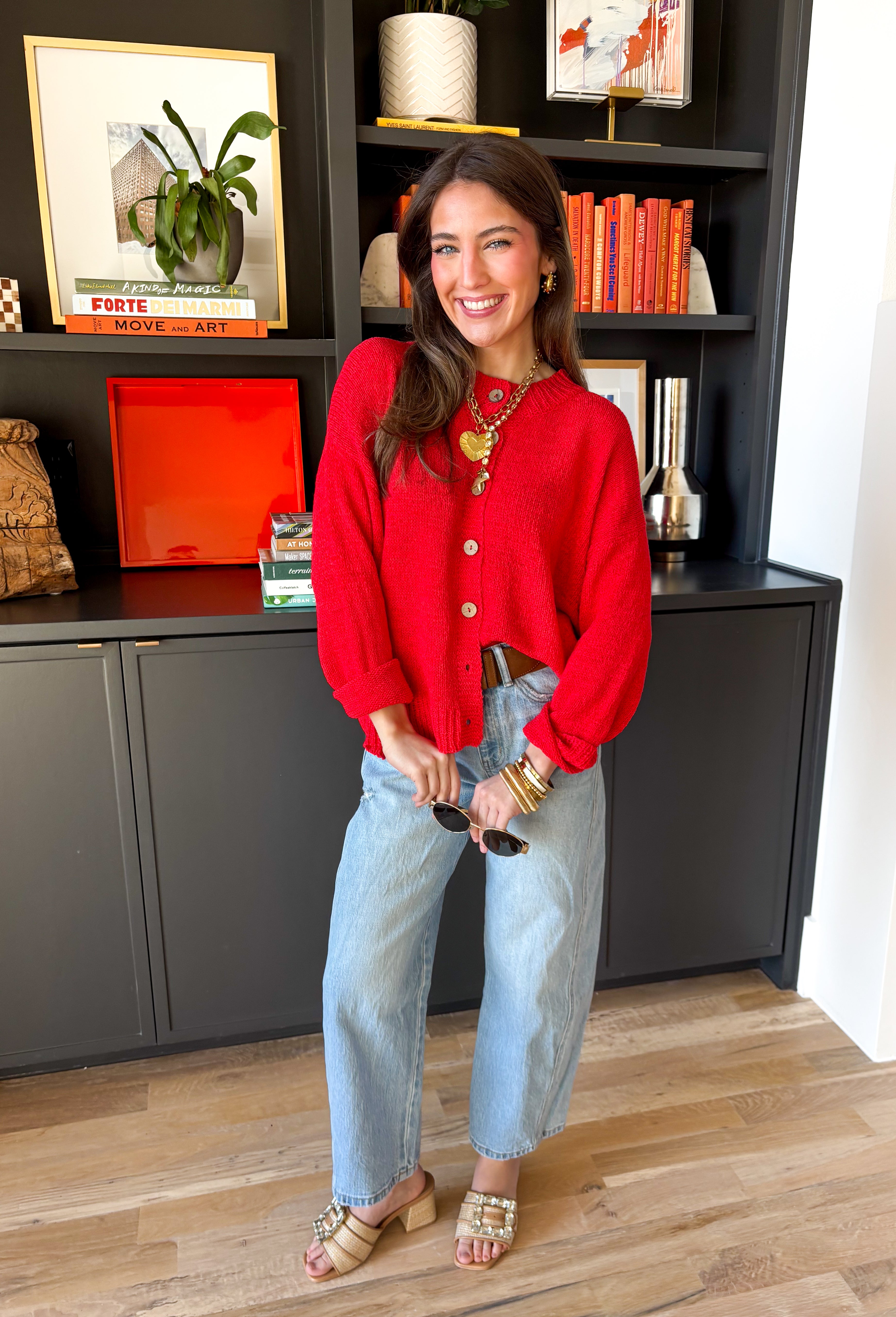 Bright, lightweight, and perfect for spring layering, this red knit button-down cardigan by Wishlist is an easy way to add a pop of color to any outfit. The soft, lightweight knit makes it ideal for tossing on during cool mornings or breezy evenings, while the classic button-down design keeps it timeless and versatile. Wear it buttoned up as a top or layered over a tank for effortless spring styling.