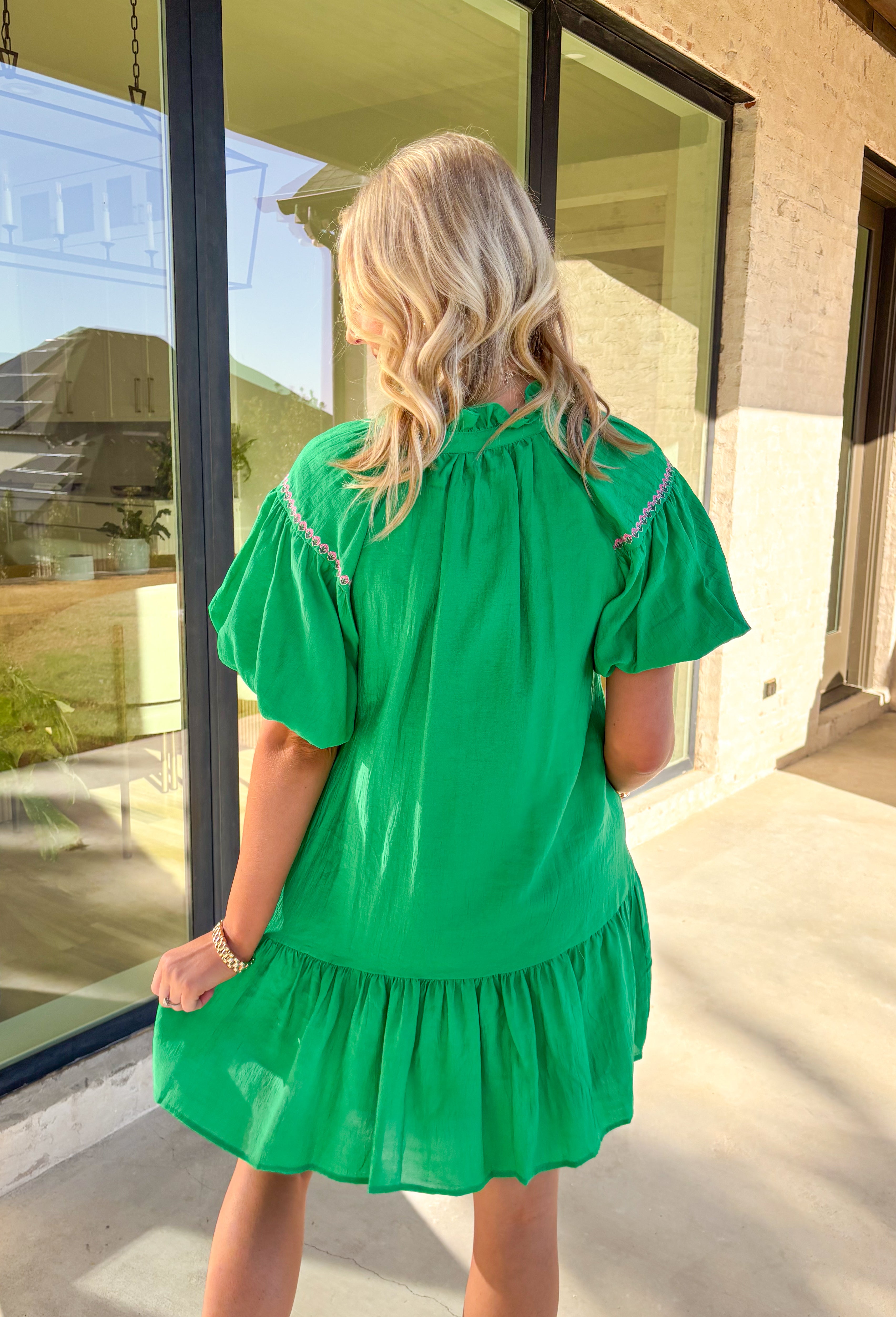Cue the compliments—this kelly green dress is springtime perfection! Featuring puff sleeves, a subtle ruffle neckline, and bold pink embroidered florals (with extra dainty details along the sleeves!), it’s as sweet as can be. Fully lined and made from 100% cotton by Umgee, this dress is light, breathable, and ready to twirl through brunches, baby showers, or your next sunny day adventure.