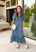 Classic stripes and feminine details make this midi dress an effortless favorite for the season. Featuring rich hunter green and soft blue stripes, this beautifully crafted cotton dress brings timeless style with a fresh autumn feel. The ruffled neckline and puff sleeves add a romantic touch, while the button-front design and flowy ruffle hem create an easy, flattering silhouette.