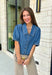 Every closet deserves a classic denim top, and this one is made to be worn on repeat! Crafted from soft medium wash denim, this timeless button-down top is an effortless staple for every season. The collared neckline gives it a polished feel, while the puff sleeves add just the right amount of feminine charm. This versatile top is one you'll reach for year after year!