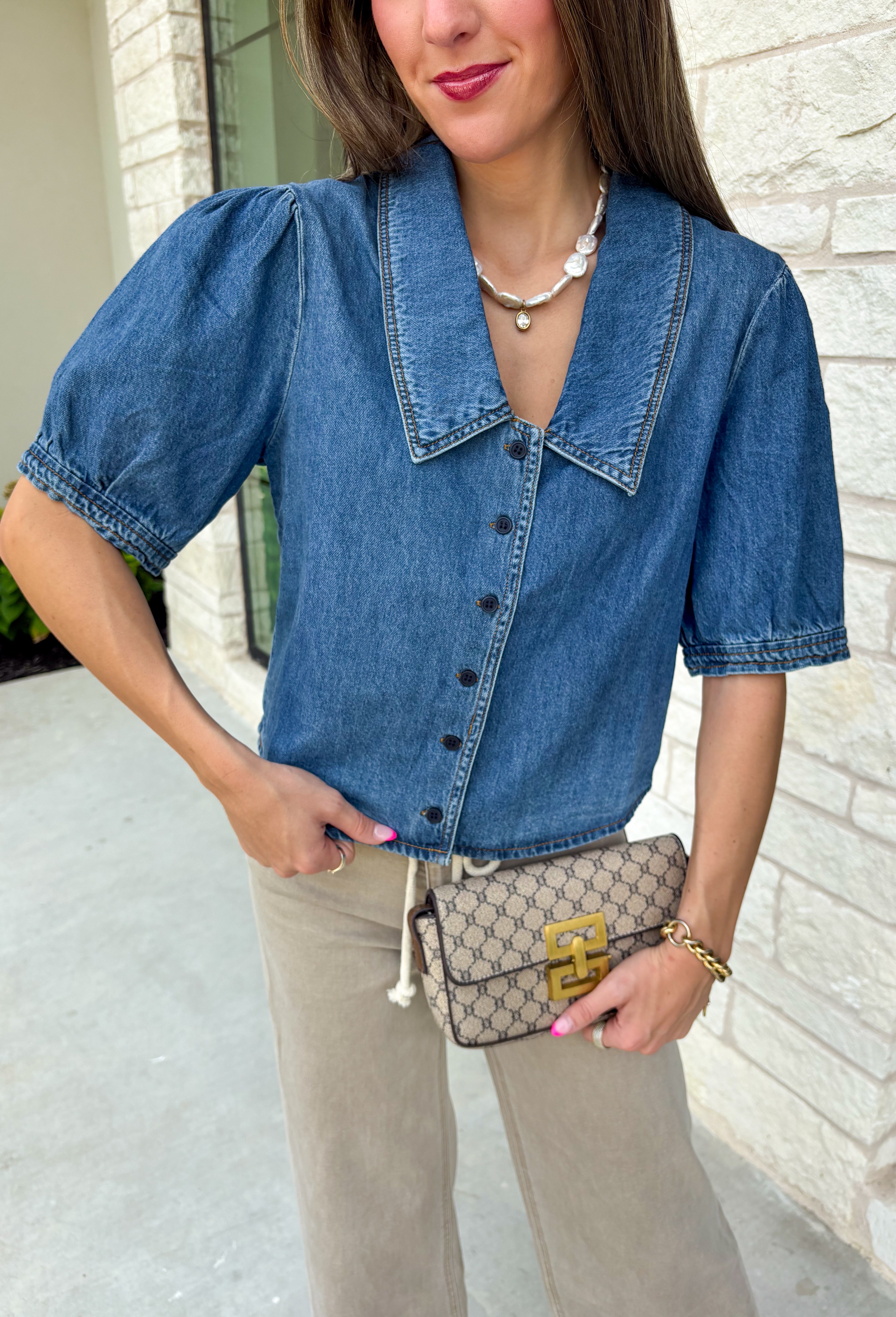 Every closet deserves a classic denim top, and this one is made to be worn on repeat! Crafted from soft medium wash denim, this timeless button-down top is an effortless staple for every season. The collared neckline gives it a polished feel, while the puff sleeves add just the right amount of feminine charm. This versatile top is one you'll reach for year after year!