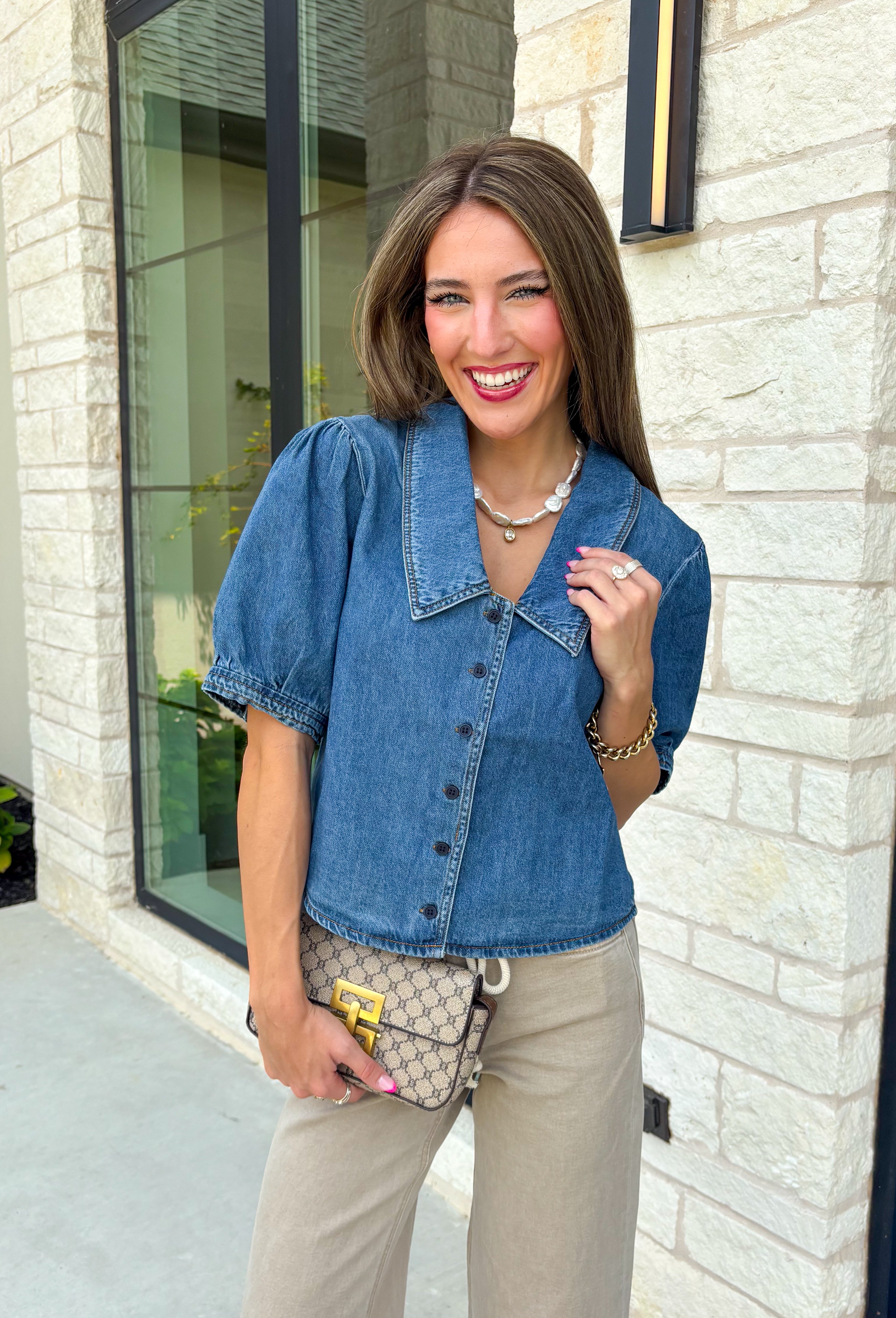 Every closet deserves a classic denim top, and this one is made to be worn on repeat! Crafted from soft medium wash denim, this timeless button-down top is an effortless staple for every season. The collared neckline gives it a polished feel, while the puff sleeves add just the right amount of feminine charm. This versatile top is one you'll reach for year after year!