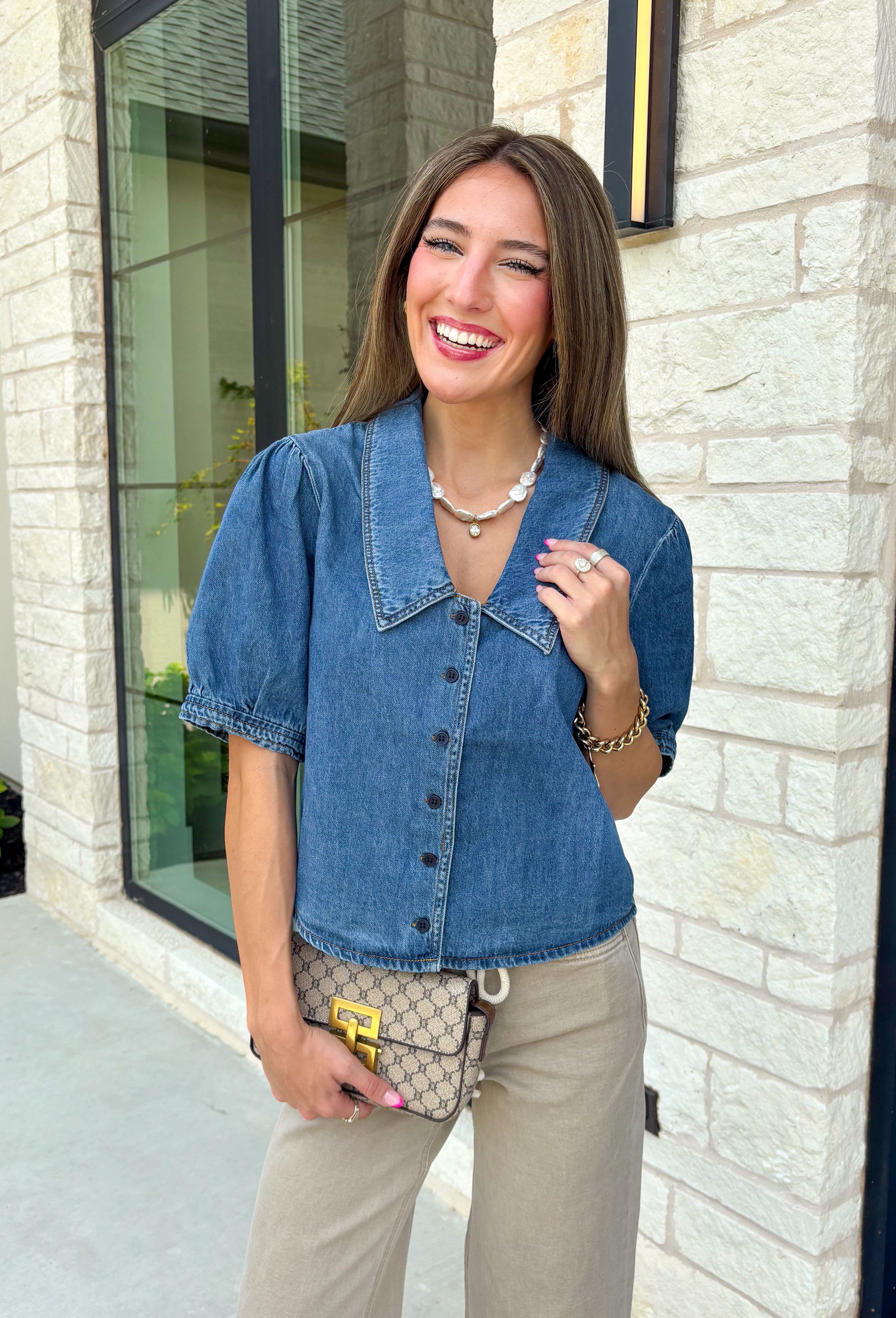 Every closet deserves a classic denim top, and this one is made to be worn on repeat! Crafted from soft medium wash denim, this timeless button-down top is an effortless staple for every season. The collared neckline gives it a polished feel, while the puff sleeves add just the right amount of feminine charm. This versatile top is one you'll reach for year after year!