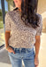 This taupe lightweight knit sweater by Fate brings effortless style to your fall wardrobe. Designed with a black leopard print, it adds a playful touch while keeping things easy and chic. The short sleeves and ribbed hem, neckline, and sleeves give it a polished finish, making it perfect for layering or wearing solo on those in-between days.