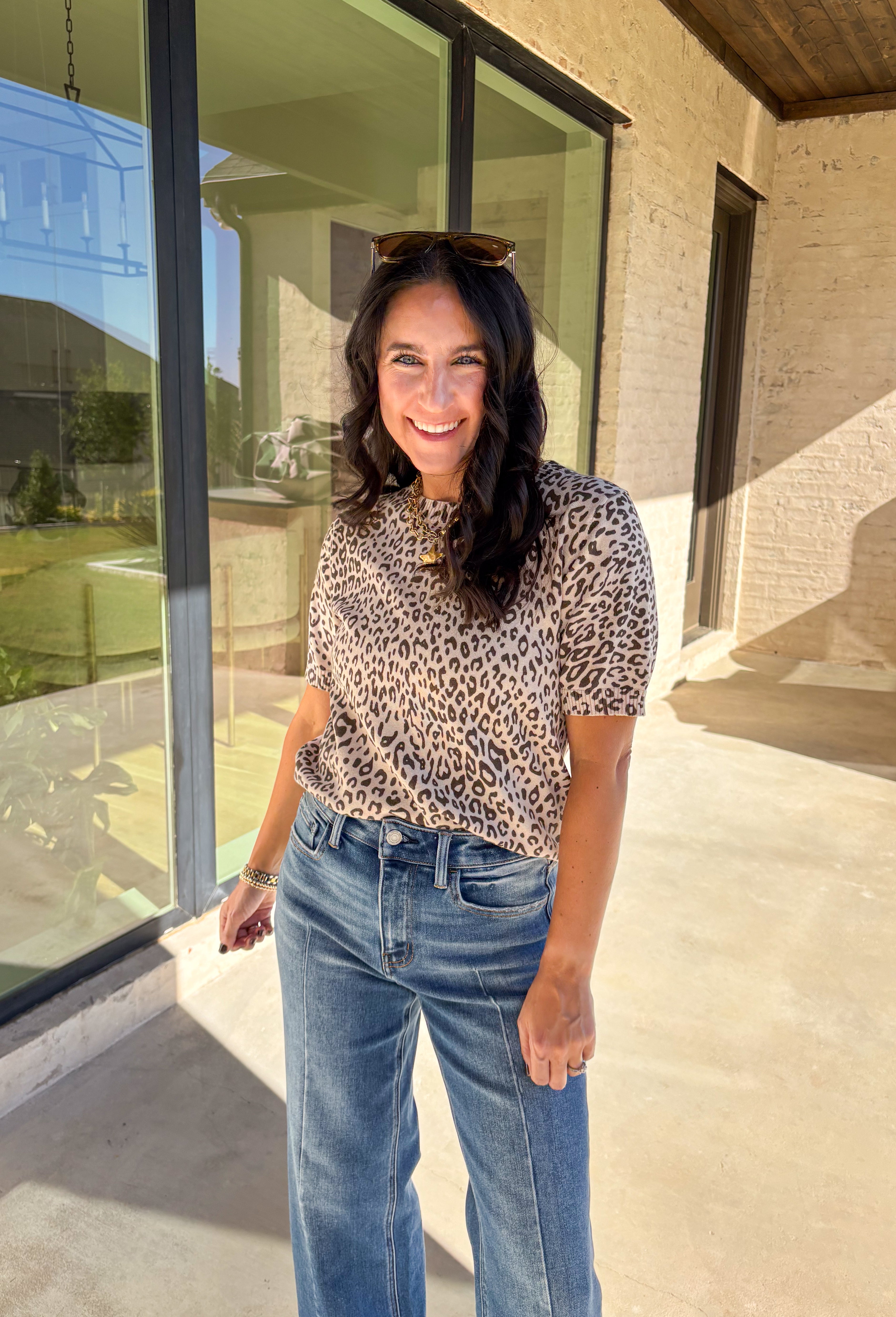 This taupe lightweight knit sweater by Fate brings effortless style to your fall wardrobe. Designed with a black leopard print, it adds a playful touch while keeping things easy and chic. The short sleeves and ribbed hem, neckline, and sleeves give it a polished finish, making it perfect for layering or wearing solo on those in-between days.