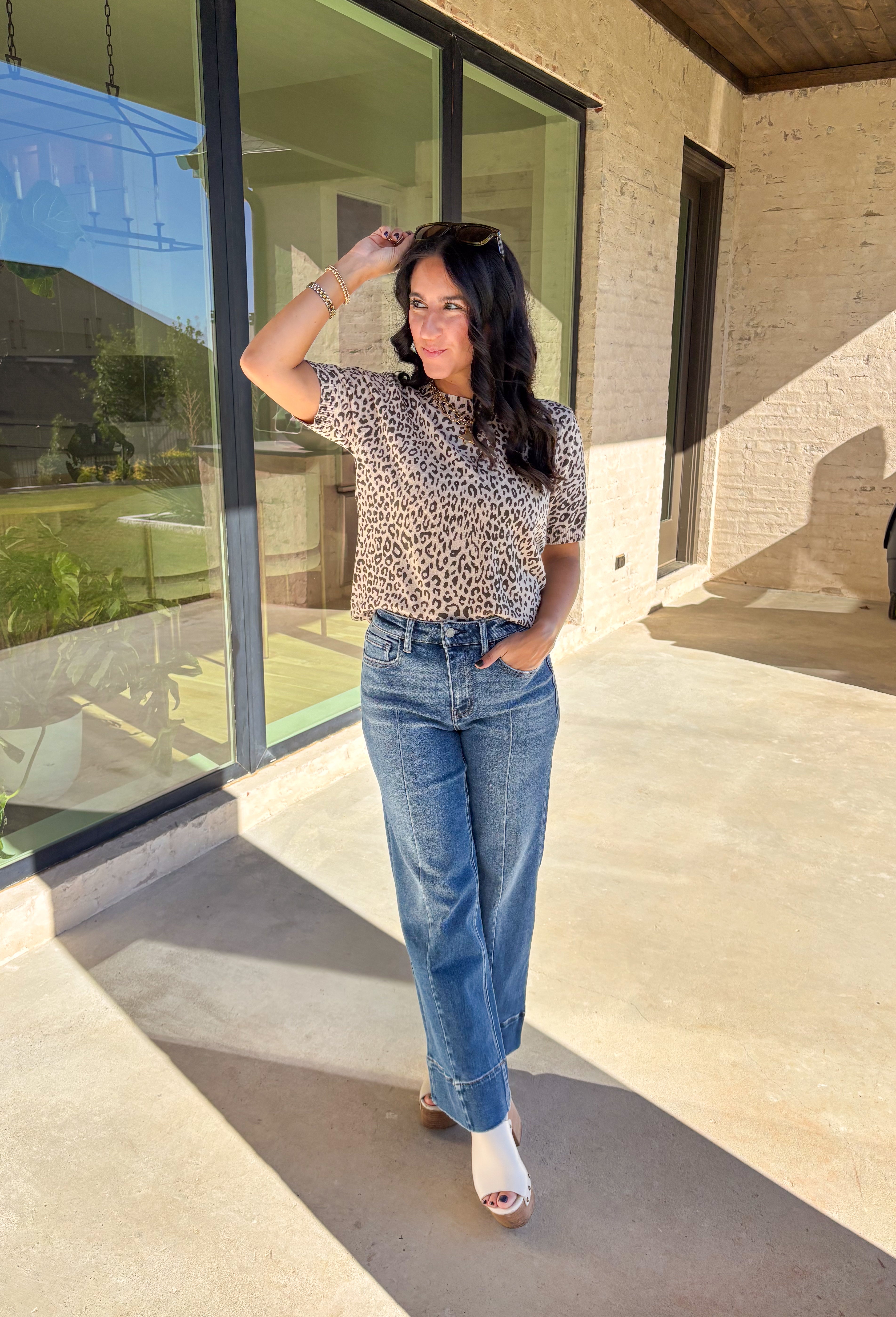 This taupe lightweight knit sweater by Fate brings effortless style to your fall wardrobe. Designed with a black leopard print, it adds a playful touch while keeping things easy and chic. The short sleeves and ribbed hem, neckline, and sleeves give it a polished finish, making it perfect for layering or wearing solo on those in-between days.