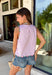 This light pink stripe tank is the sweetest mix of playful and feminine for summer! Featuring pink, red, and green floral embroidery, it adds the prettiest pop of color against the soft striped base. The scalloped hem and sleeves give it that extra delicate detail, while the side tie accents and keyhole back keep it feeling unique and thoughtfully designed. Lightweight and breathable in 100% cotton, it’s perfect for warm days when you want to feel cute and put together. 