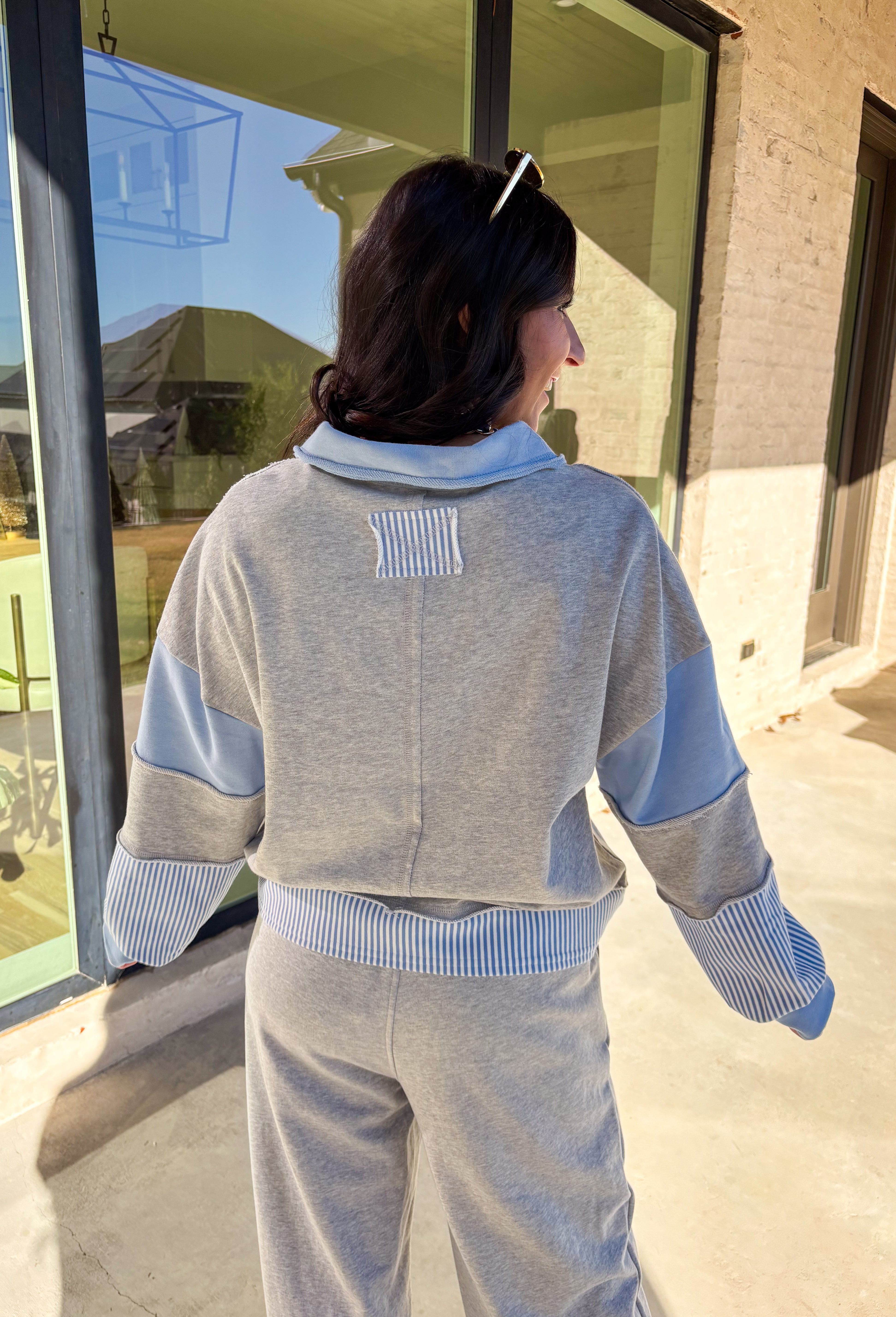 Effortless style meets everyday comfort in this lightweight two-piece set by New In. The heather gray long sleeve top features sporty blue and off-white stripe detailing along the front, sleeves, and hem for a fresh pop of color. The matching wide leg pants tie it all together with a coordinating blue waistband and drawstring. Wear them as a matching set for a put-together look or mix and match for laid-back spring days.