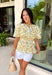 This neutral floral top is such a bright and easy pick for summer days! The soft yellow floral print with subtle pops of green gives it that fresh, feel-good look that’s perfect for the season. The smocked elastic waist creates a flattering shape while still keeping things comfortable and easy to wear. Finished with a v-neckline, it has that effortless, feminine feel you’ll reach for again and again. Lightweight and breathable in cotton, it’s perfect for everything from errands to lunch plans. 