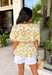 This neutral floral top is such a bright and easy pick for summer days! The soft yellow floral print with subtle pops of green gives it that fresh, feel-good look that’s perfect for the season. The smocked elastic waist creates a flattering shape while still keeping things comfortable and easy to wear. Finished with a v-neckline, it has that effortless, feminine feel you’ll reach for again and again. Lightweight and breathable in cotton, it’s perfect for everything from errands to lunch plans. 