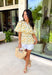 This neutral floral top is such a bright and easy pick for summer days! The soft yellow floral print with subtle pops of green gives it that fresh, feel-good look that’s perfect for the season. The smocked elastic waist creates a flattering shape while still keeping things comfortable and easy to wear. Finished with a v-neckline, it has that effortless, feminine feel you’ll reach for again and again. Lightweight and breathable in cotton, it’s perfect for everything from errands to lunch plans. 