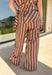 Easy, comfortable, and made for mixing and matching, these neutral stripe pants are a fall wardrobe win. The classic stripe print keeps them versatile, while the elasticated waistband and adjustable drawstring give them a relaxed feel that's ready for all-day wear. Convenient side pockets add an everyday touch that makes them just as practical as they are cute. 
