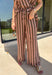 Easy, comfortable, and made for mixing and matching, these neutral stripe pants are a fall wardrobe win. The classic stripe print keeps them versatile, while the elasticated waistband and adjustable drawstring give them a relaxed feel that's ready for all-day wear. Convenient side pockets add an everyday touch that makes them just as practical as they are cute. 