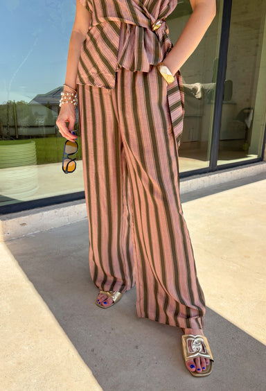 Easy, comfortable, and made for mixing and matching, these neutral stripe pants are a fall wardrobe win. The classic stripe print keeps them versatile, while the elasticated waistband and adjustable drawstring give them a relaxed feel that's ready for all-day wear. Convenient side pockets add an everyday touch that makes them just as practical as they are cute. 