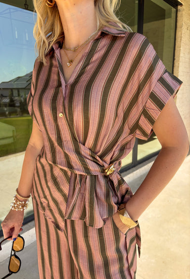 Warm neutral stripes make this Entro top an easy addition to your fall lineup. The button-front design gives it a classic feel, while the self-tie waist adds shape and a playful finishing touch. Short sleeves keep it lightweight enough for those warmer autumn days, making it an easy option for work, lunch plans, or a weekend out. Pair it with the matching pants for a coordinated two-piece set that does all the styling for you, or wear it individually with denim or solid bottoms for even more outfit options.