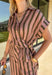 Warm neutral stripes make this Entro top an easy addition to your fall lineup. The button-front design gives it a classic feel, while the self-tie waist adds shape and a playful finishing touch. Short sleeves keep it lightweight enough for those warmer autumn days, making it an easy option for work, lunch plans, or a weekend out. Pair it with the matching pants for a coordinated two-piece set that does all the styling for you, or wear it individually with denim or solid bottoms for even more outfit options.