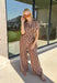 Warm neutral stripes make this Entro top an easy addition to your fall lineup. The button-front design gives it a classic feel, while the self-tie waist adds shape and a playful finishing touch. Short sleeves keep it lightweight enough for those warmer autumn days, making it an easy option for work, lunch plans, or a weekend out. Pair it with the matching pants for a coordinated two-piece set that does all the styling for you, or wear it individually with denim or solid bottoms for even more outfit options.