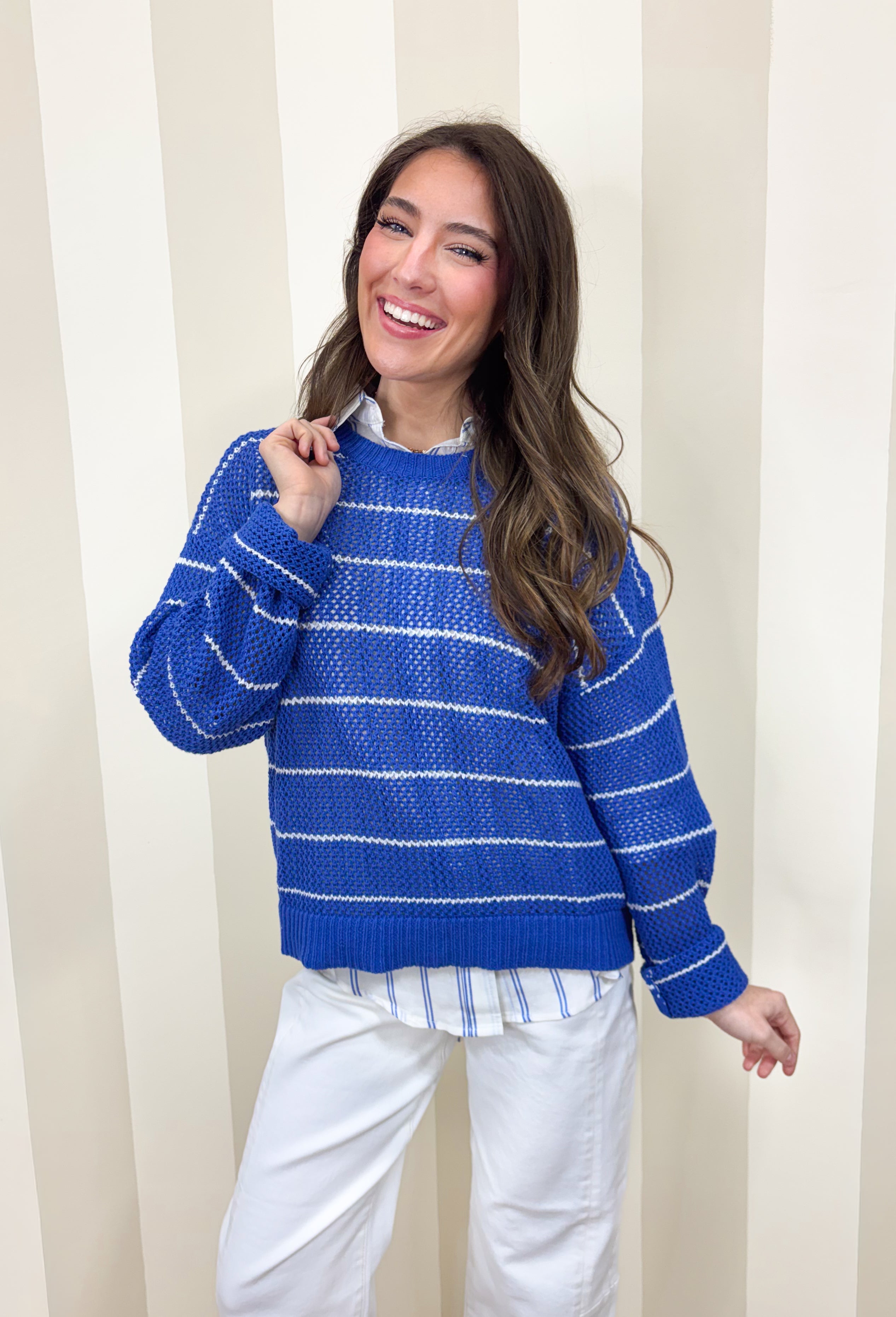 Lightweight, breezy, and perfect for spring layering, this blue and white striped open knit sweater by Wishlist is an easy warm-weather staple. The open knit design keeps it airy and relaxed, making it perfect for tossing on over a tank or bralette on sunny days. With timeless stripes and a soft knit feel, this sweater gives effortless coastal vibes—whether you’re headed to brunch, the beach, or just want something cute and comfy for everyday.