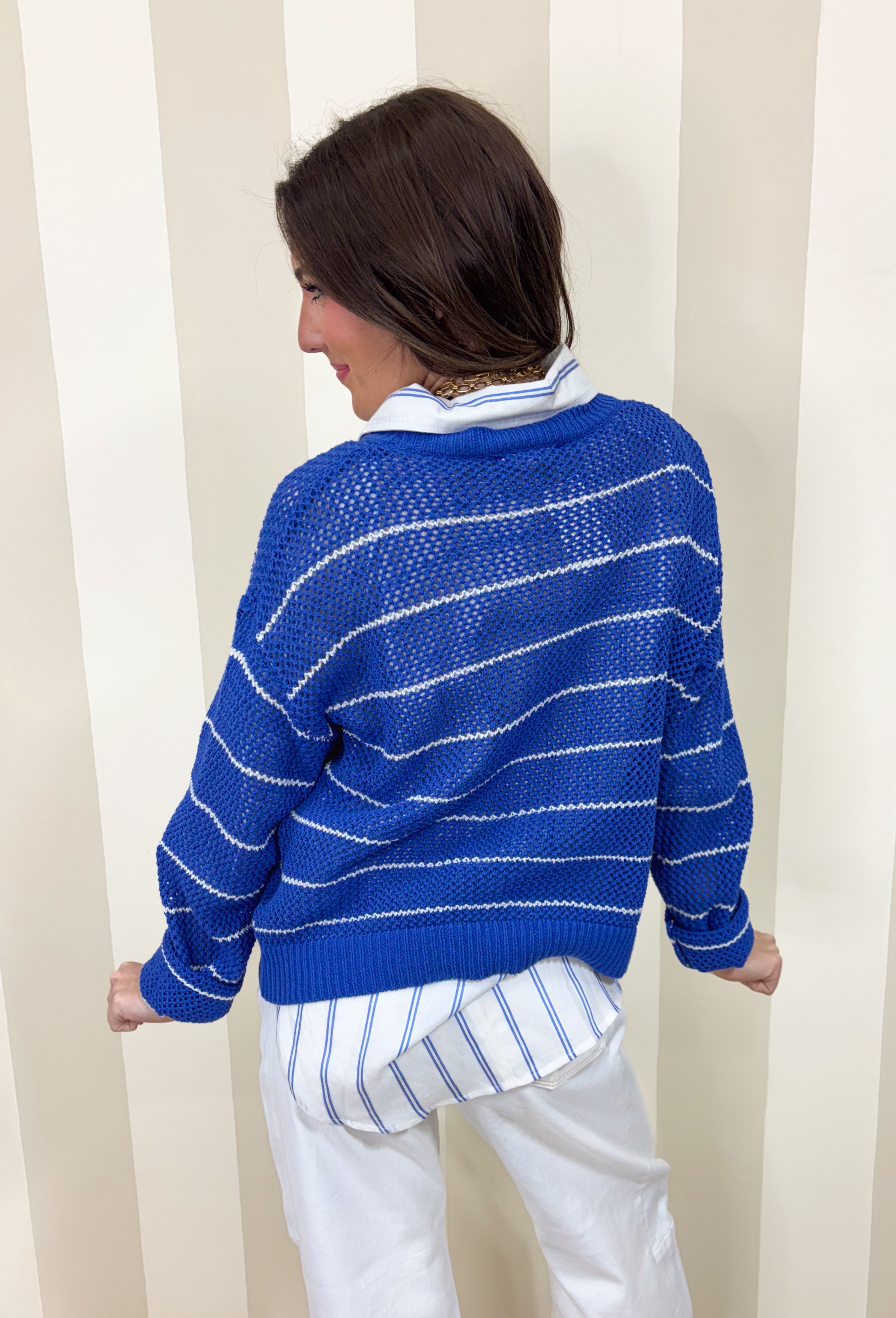 Lightweight, breezy, and perfect for spring layering, this blue and white striped open knit sweater by Wishlist is an easy warm-weather staple. The open knit design keeps it airy and relaxed, making it perfect for tossing on over a tank or bralette on sunny days. With timeless stripes and a soft knit feel, this sweater gives effortless coastal vibes—whether you’re headed to brunch, the beach, or just want something cute and comfy for everyday.